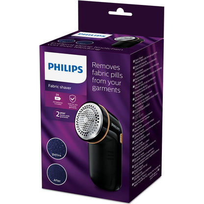 Philips GC026/80 fnugfjerner æske med enhed, før/efter-billeder, nøglefunktioner og 2 års garanti badge.