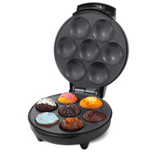 Champion Muffin Bage Maskine 700W sort med åben låge, syv dekorerede minimuffins og syv tomme former.