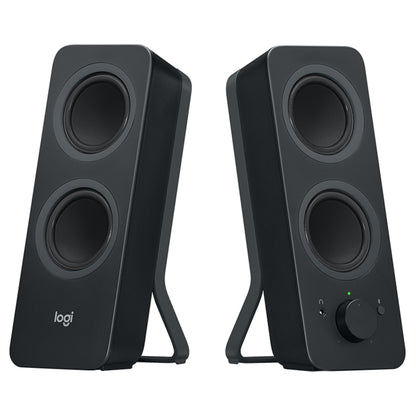 Logitech Z207 Bluetooth-computerhøjttalere, to sorte højttalere med dobbelte drivere, lydstyrkeknap og hovedtelefonstik.