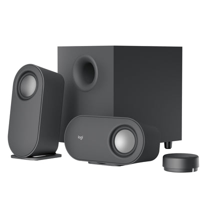 Logitech Z407 højttalersystem, to sorte højttalere, subwoofer og trådløs cylindrisk lydstyrkekontrol.