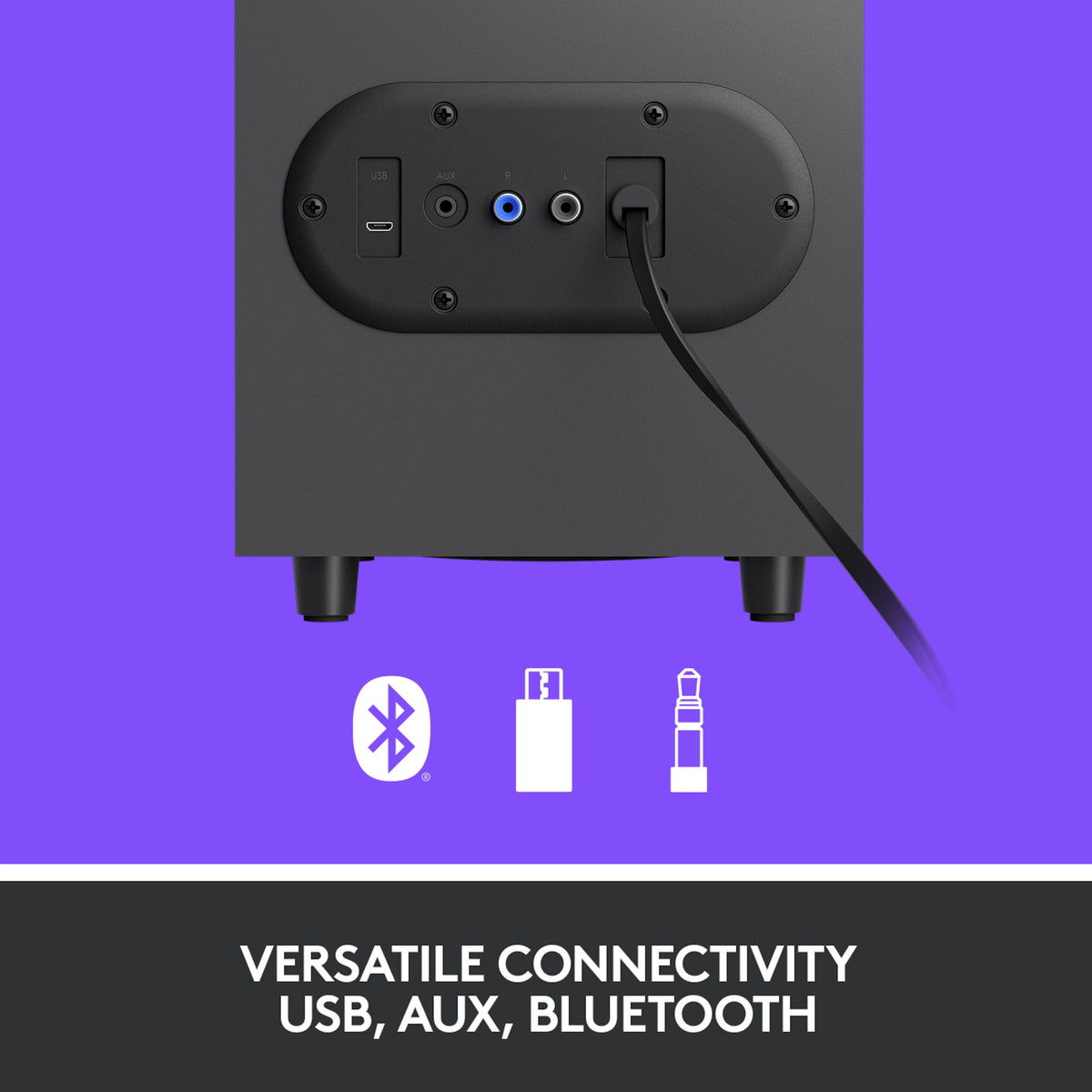 Bagsiden af Logitech Z407-subwooferen med USB-, AUX- og lydporte samt ikoner for Bluetooth, USB og 3,5 mm-tilslutning.