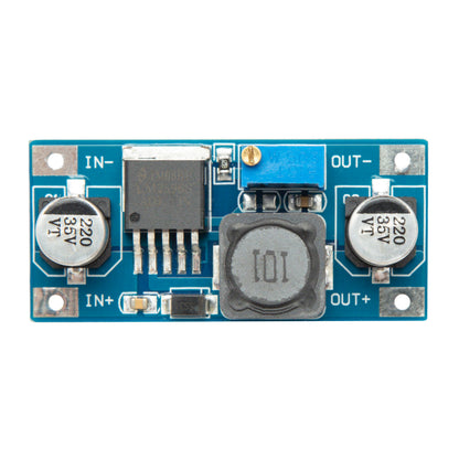 Luxorparts variabel spændingsregulator Switched blå modul med mærkede ind/udgange, heatsink, IC-chip, kondensatorer, potentiometer.