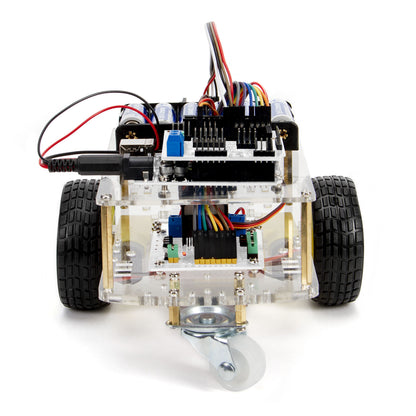 Arduino Robotbil Startpakke med to hjul, gennemsigtigt chassis, elektroniske dele, printplader, ledninger og frontstyrerhjul.