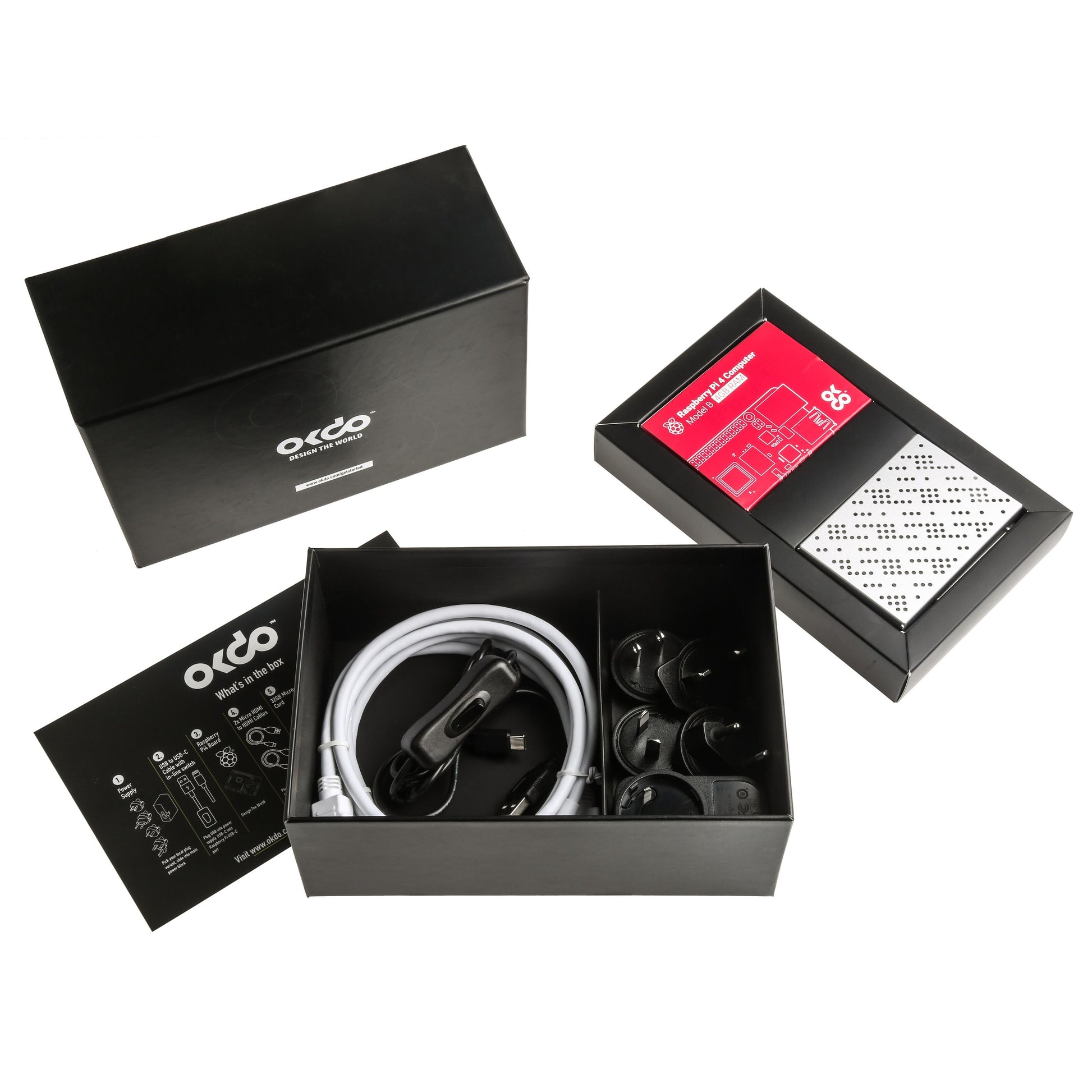 Raspberry Pi 4 Kit 4GB sort gaveæske med Otco-logo, internationale stik, hvidt kabel og billader.