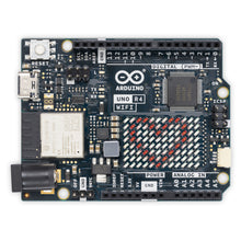 Arduino Uno Rev4 Wifi udviklingskort topview med mærkede porte, trådløs modul, USB-C stik, mikrochip og pin-headers.