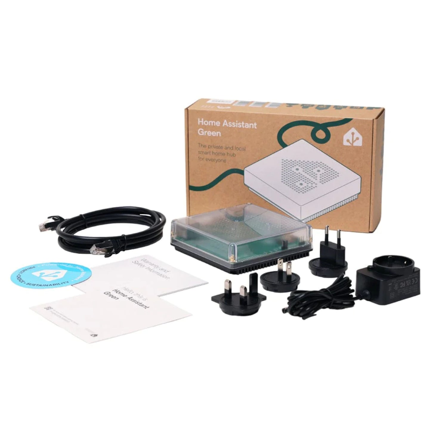 Nabu Casa Home Assistant grøn, kompakt enhed med flere strømstikadaptere, strømkabel, Ethernet-kabel, manualer, klistermærke.