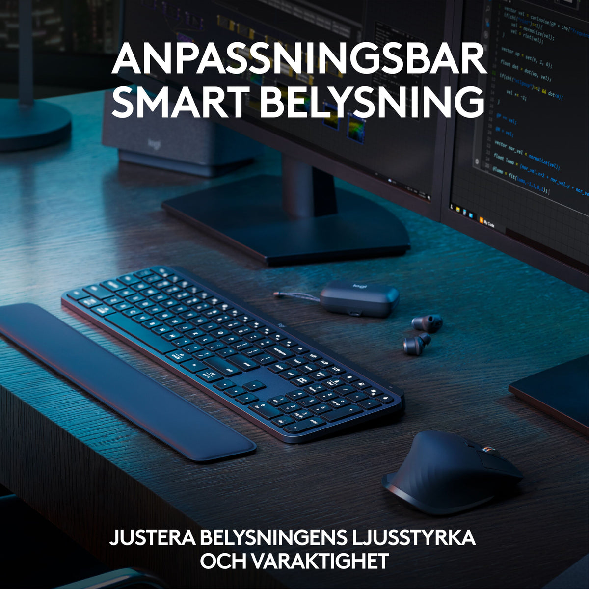 Logitech MX Keys S Combo – trådløst tastatur, håndledsstøtte og ergonomisk mus i farven Graphite på et skrivebord med kodeskærme.