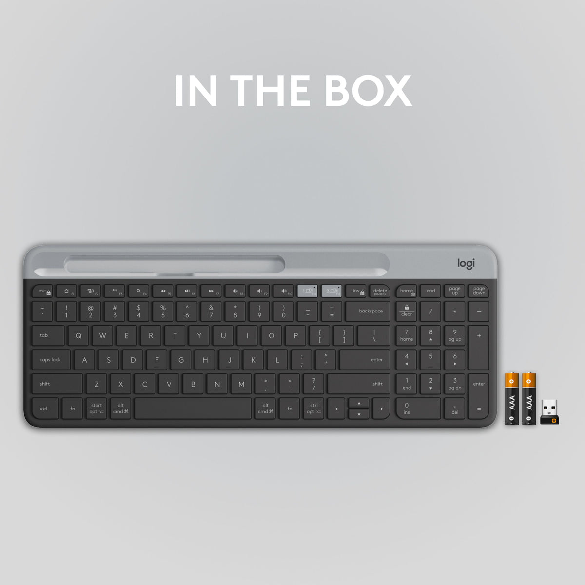 Logitech K580 trådløst tastatur med numerisk tastatur, to AAA-batterier og USB-modtager til flere enheder.
