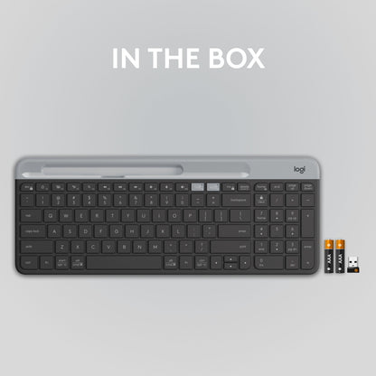 Logitech K580 trådløst tastatur med numerisk tastatur, to AAA-batterier og USB-modtager til flere enheder.