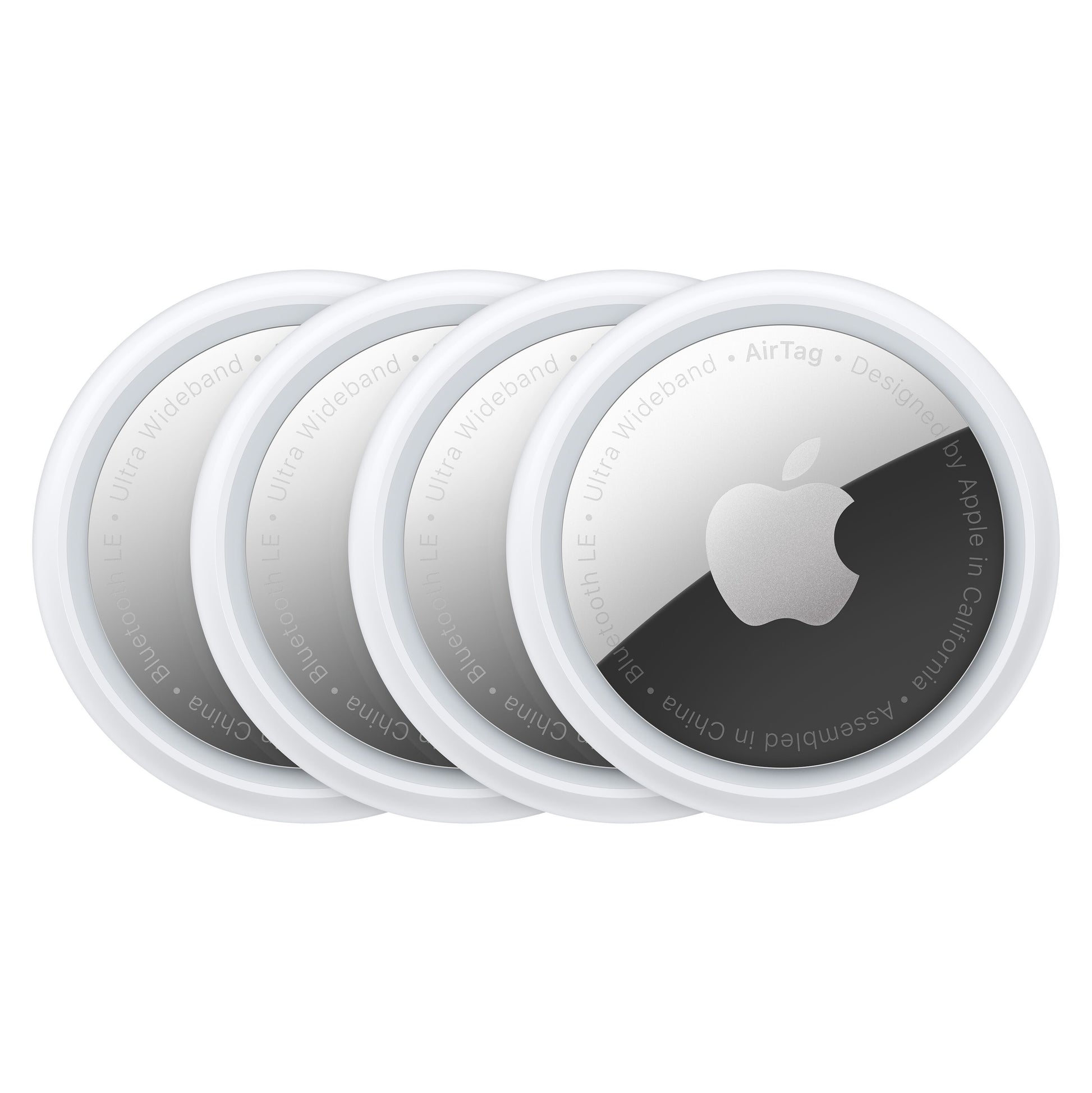 Apple AirTag 4-pak, fire hvide runde sporingsenheder med metallisk midte og Apple-logo.