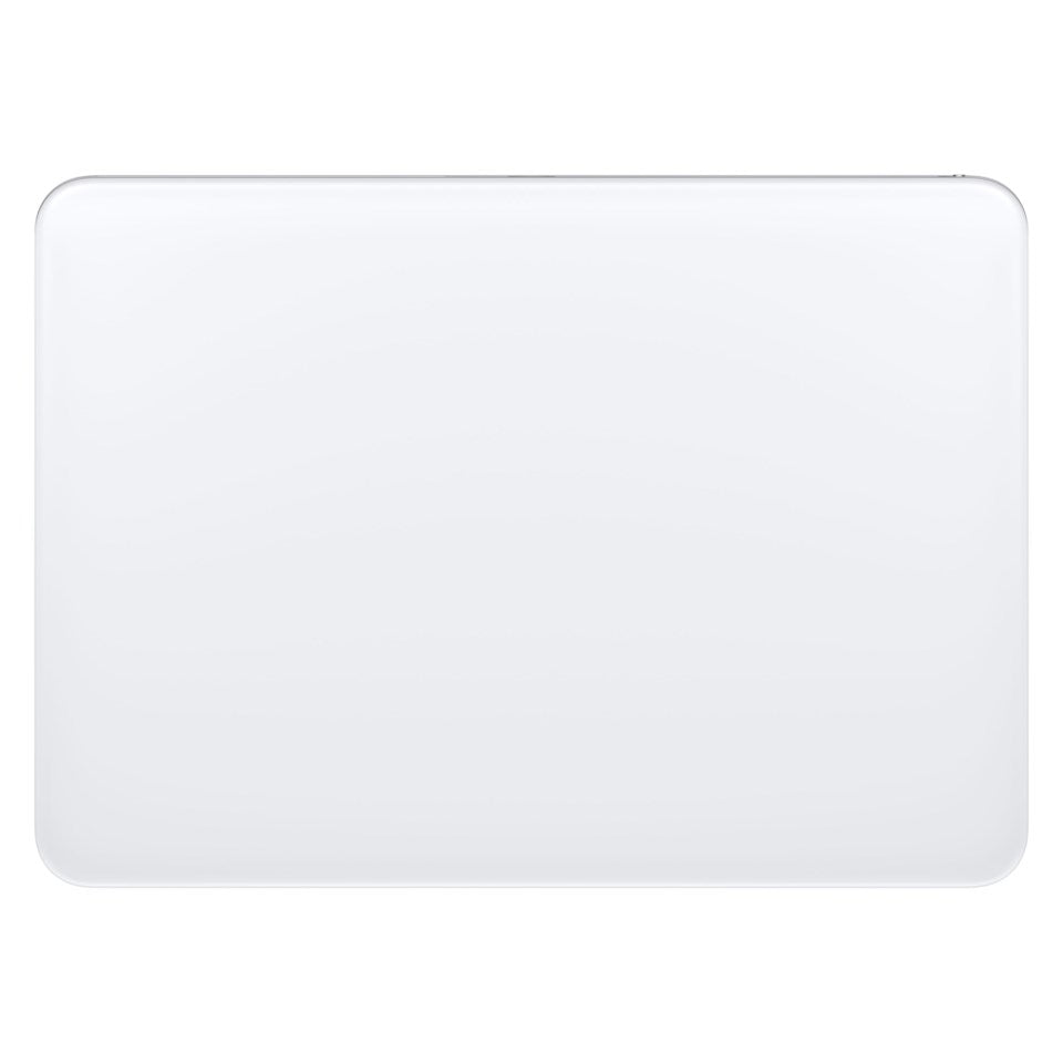 Apple laptop sølv set oppefra med runde hjørner og Magisk Trackpad til Multi-Touch trådløs kontrol.