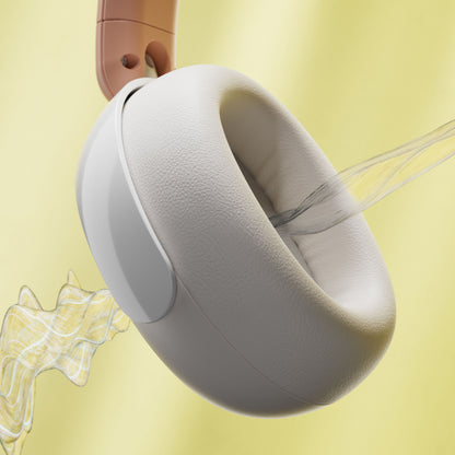 Philips trådløs over-ear hovedtelefon til børn i beige med støjreduktion, adaptive linjer synlige, gul baggrund.