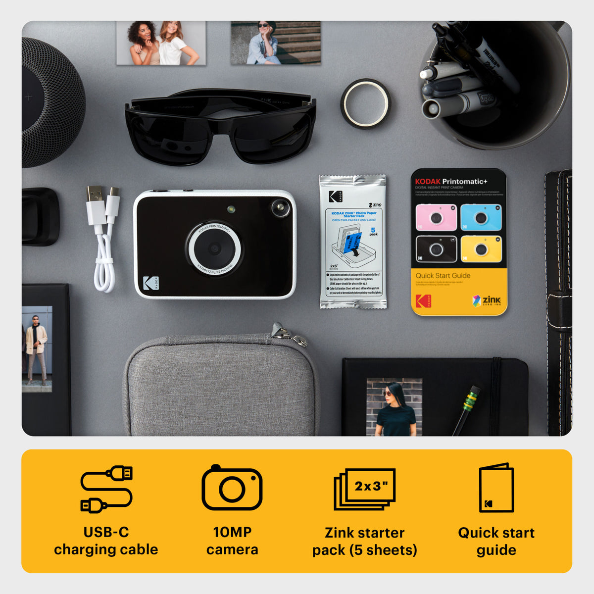 Kodak Printomatic+ instantkamera på 10 MP med ZINK-udskrivning, USB-C-kabel, ZINK-papir, hurtigvejledning, solbriller og kuglepenne.