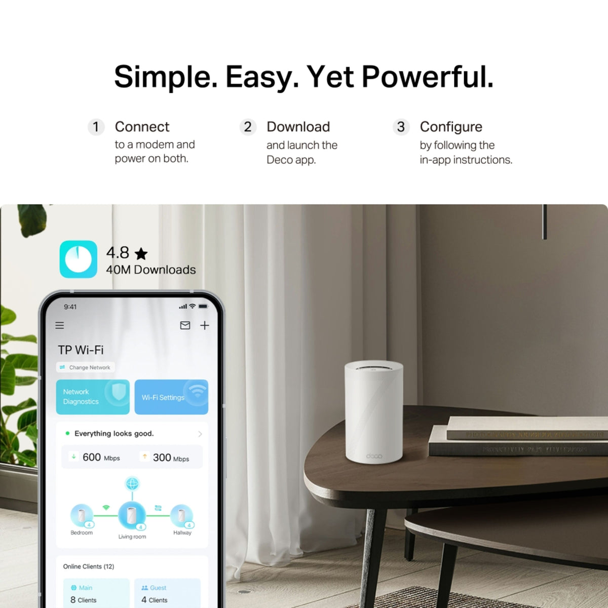 TP-Link Deco BE68 Wi-Fi 7 tri-band mesh-system og smartphone med netværksapp på bordet.
