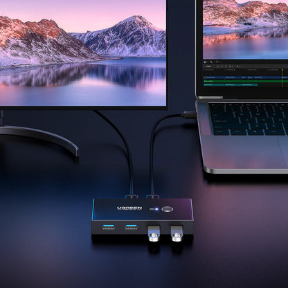 Ugreen USB 3.0-switch med 4 porte, 5 Gbps, til deling af tilbehør mellem to computere og en skærm.
