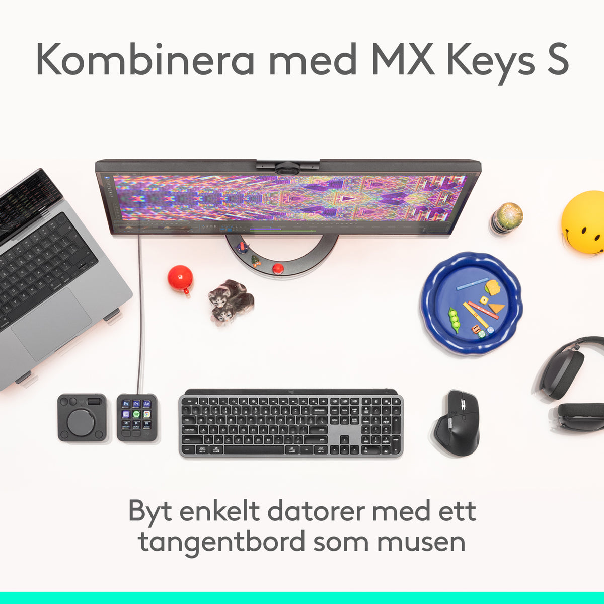 Logitech MX Master 4 trådløs ergonomisk mus i farven Graphite med haptisk feedback på et skrivebord med bærbar computer og skærm.