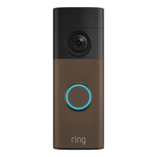 Ring Battery Video Doorbell Retinal 2K i mat mokka med kamera øverst, blå oplyst knap og »ring«-logo nederst.