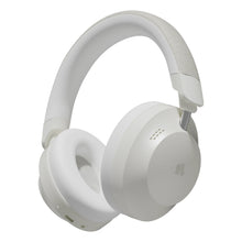 Nomadelic Solo 550 trådløse over-ear-hovedtelefoner i beige med polstrede ørekopper, polstret hovedbøjle, Hybrid ANC og logo på højre ørekop.