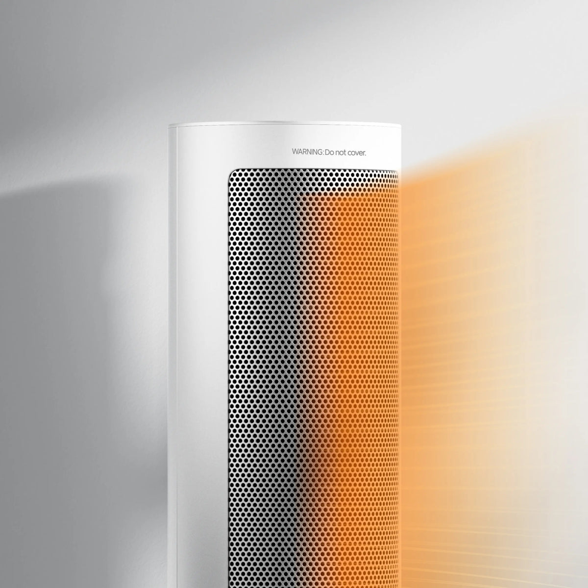 Xiaomi Fan Heater EU PTC-varmeblæser 2000 W, hvid, perforeret front, varm orange glød, tekst: ADVARSEL: Må ikke tildækkes.