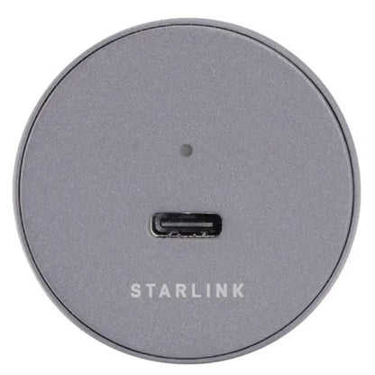 Starlink Mini-biladapter, rund og grå, USB-C til 12–24 V med USB-C-port og indikatorlampe.