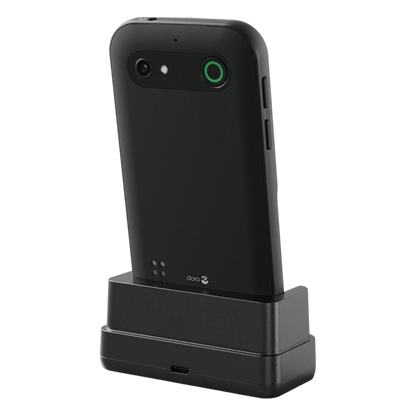 Doro Leva E11 knaptelefon, sort med kamera og grøn ring, set bagfra i sort opladestation.