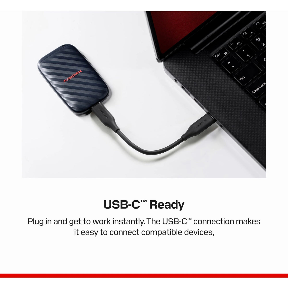 SanDisk bærbar SSD 1 TB USB-C 600 MB/s tilsluttet bærbar computer med USB-C-kabel.