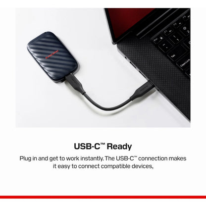 SanDisk bærbar SSD 1 TB USB-C 600 MB/s tilsluttet bærbar computer med USB-C-kabel.