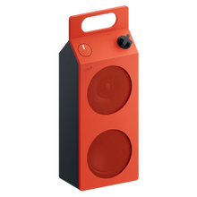 Nothing CMF Speaker M – bærbar Bluetooth-højttaler i orange og mørkegrå med to runde gitre, håndtag, knap og sort drejeknap.