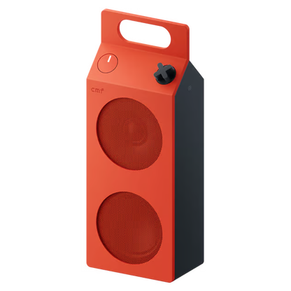 Orange Nothing CMF Speaker M – bærbar Bluetooth-højttaler med to runde gitre, håndtag på toppen, tænd/sluk-knap og drejeknap.