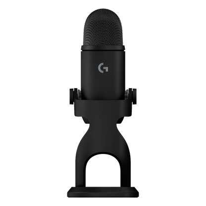 Logitech G Yeti 2 USB-mikrofon i sort med AI-støjreduktion på bordstativ med rundt gitter og logo foran.