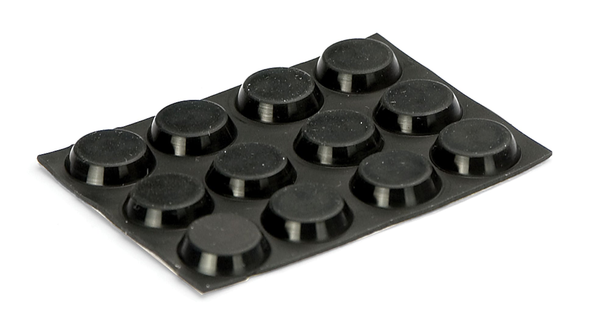 Sort rektangulær plade med 12 runde, hævede Flade apparatfødder i 3x4 gitter, set i let vinkel.
