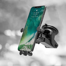Linocell mobilholder sort med sugekop og 360° rotation til forrude, holder smartphone med låst skærmbillede.