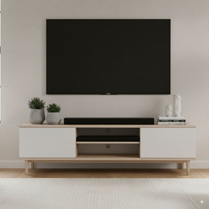 Nomadelic 2.1 Soundbar Loud 750 sort under vægmonteret fladskærm på træ tv-bord med hvide låger.